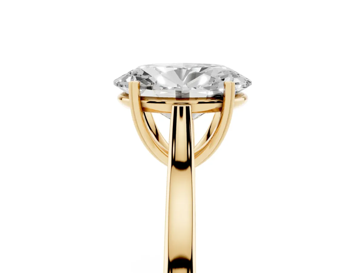 Oval Cut Solitaire Heart Prong Engagement Ring with Tapered Band Yellow gold