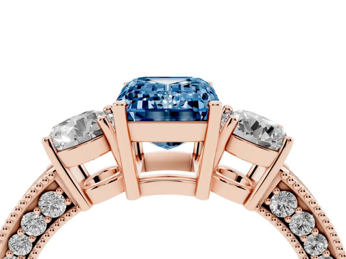 Fancy Blue Emerald Cut Three-Stone Diamond Ring with Pavé Band and Four-Prong Setting Rose gold