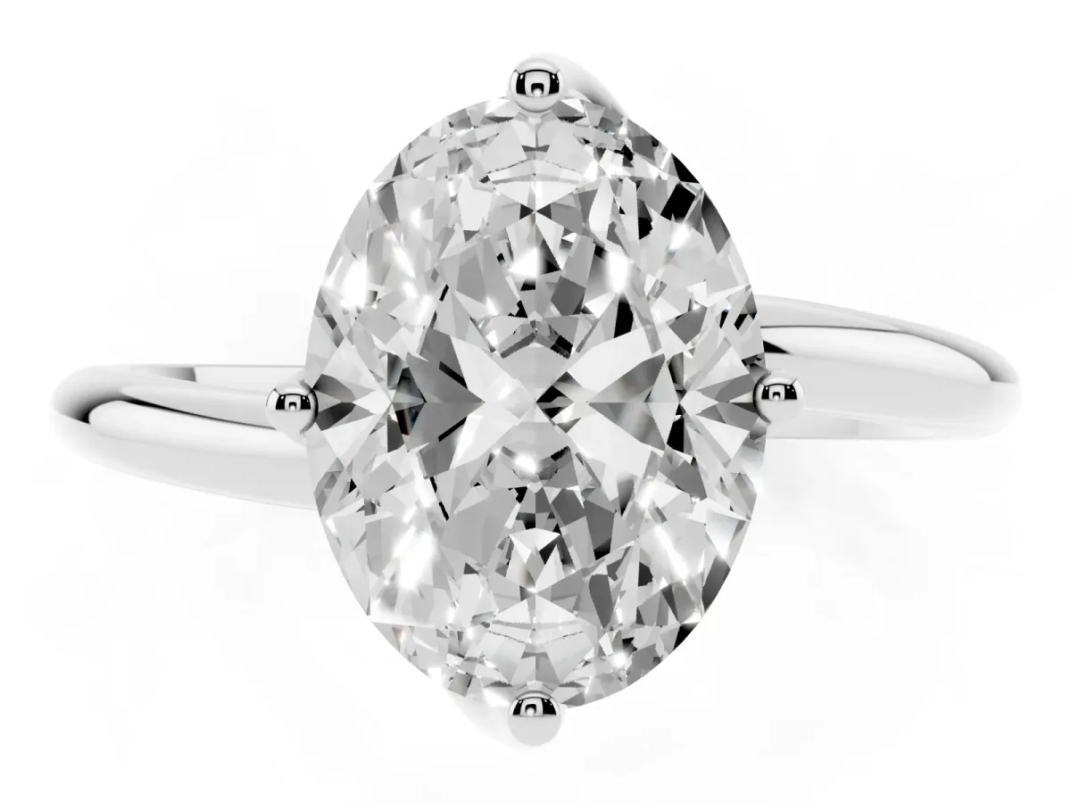 Oval Cut Diamond Solitaire Engagement Ring with Four-Prong Setting and Classic Band Silver