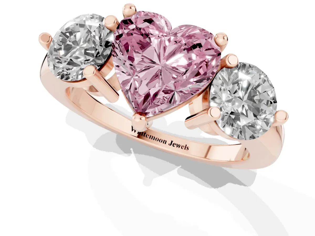 Fancy Pink Three-Stone Heart Cut Brilliant Cut Solitaire Ring with Prong Setting on a Classic Band Rose gold