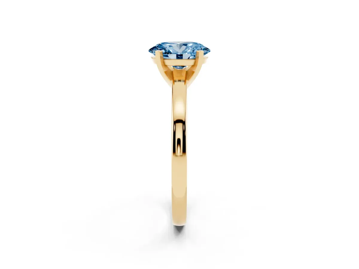 Fancy Blue Oval Cut Solitaire Diamond Engagement Ring with Four-Prong Setting on a Classic Band Yellow gold