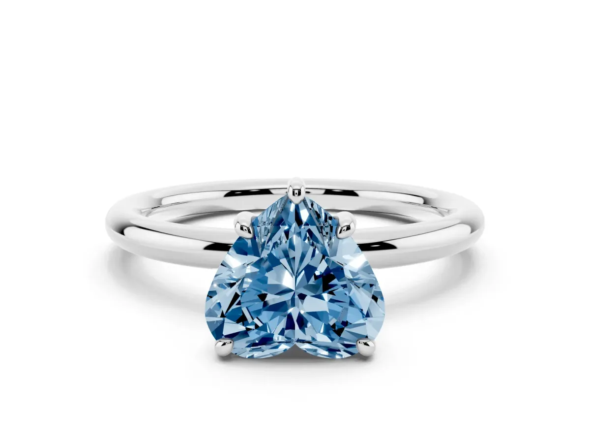Fancy Blue Heart Cut Solitaire Diamond Ring with Four-Prong Setting on a Plain Band Platinum