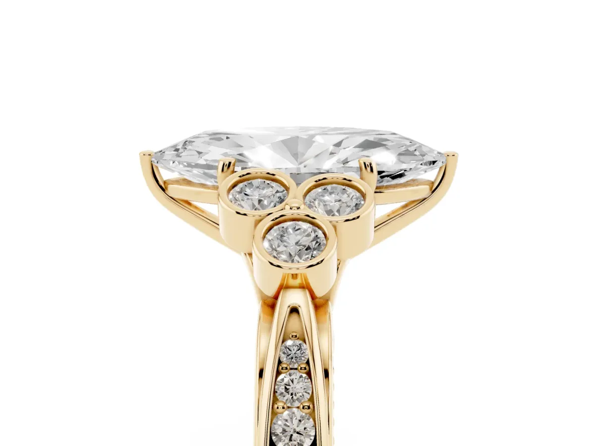 Marquise Cut Cut Diamond Engagement Ring with Bezel Set Round Side Stones and Prong Setting Yellow gold