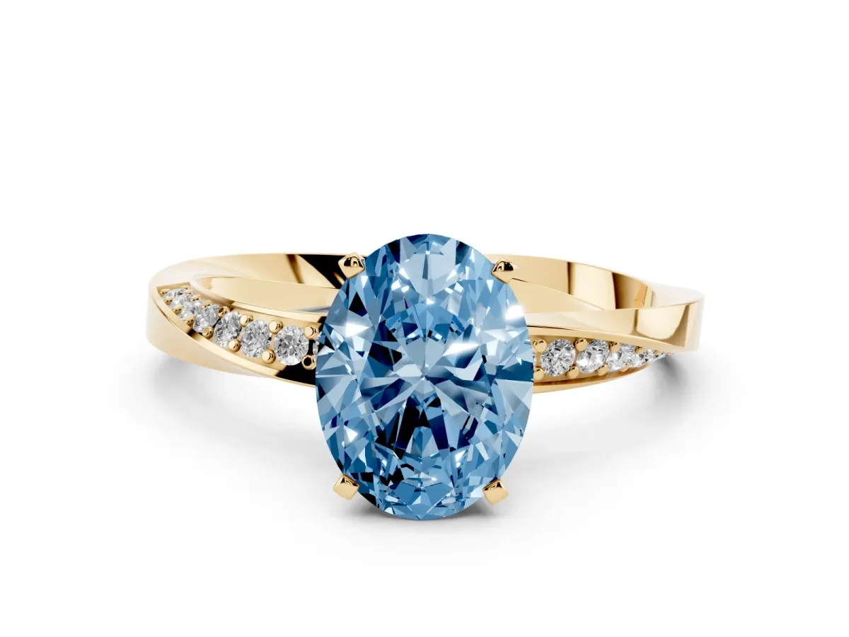 Fancy Blue Oval Cut Diamond Engagement Ring with Side Stone Accents and Four-Prong Setting Yellow gold