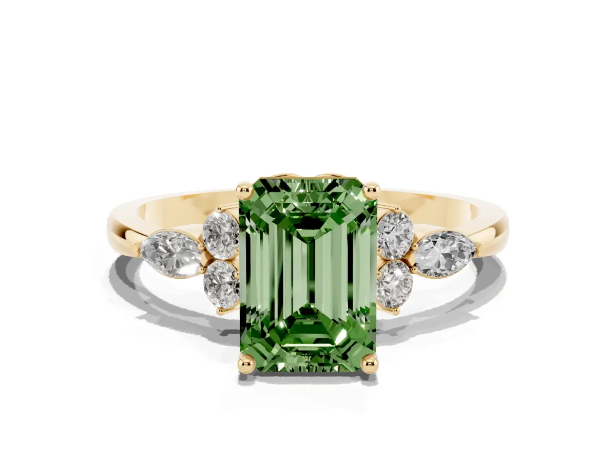 Fancy Green Emerald Cut Brilliant Diamond Solitaire Ring with Pear Side Stones and Four-Prong Setting Yellow gold