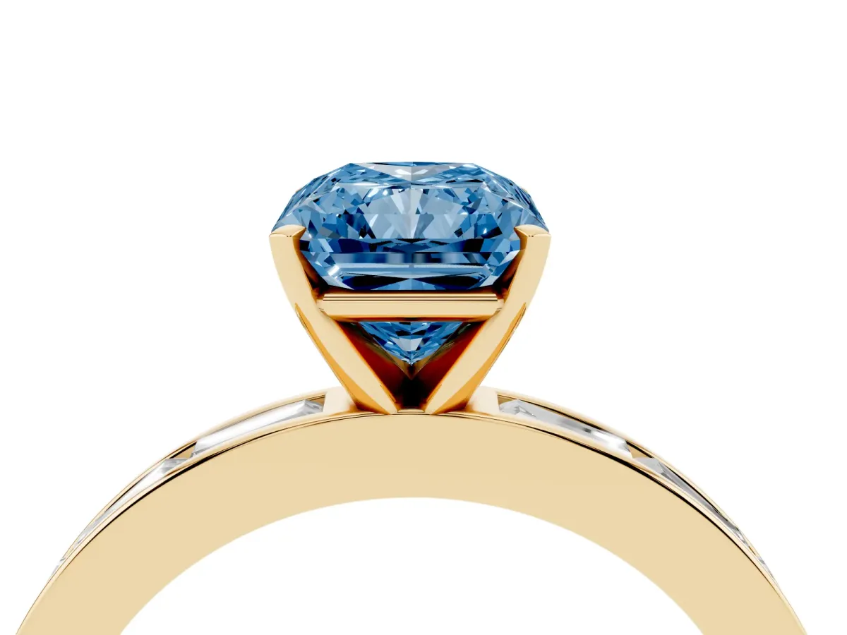 Fancy Blue Radiant Cut Solitaire Diamond Ring with Channel-Set Baguette Band and Four-Prong Setting Yellow gold
