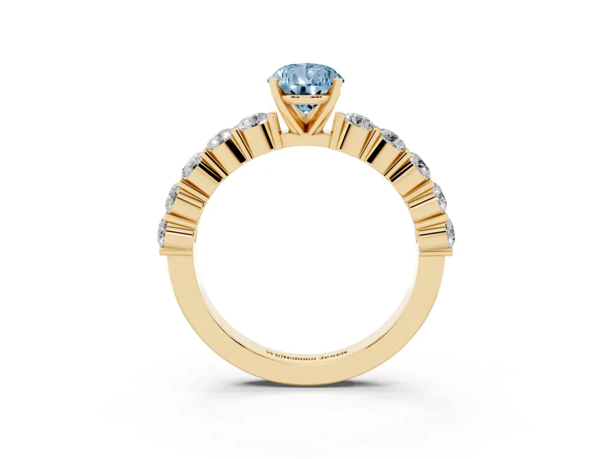 Fancy Blue Pear Cut Diamond Solitaire Ring with Shared Prong Round Side Stones Yellow gold