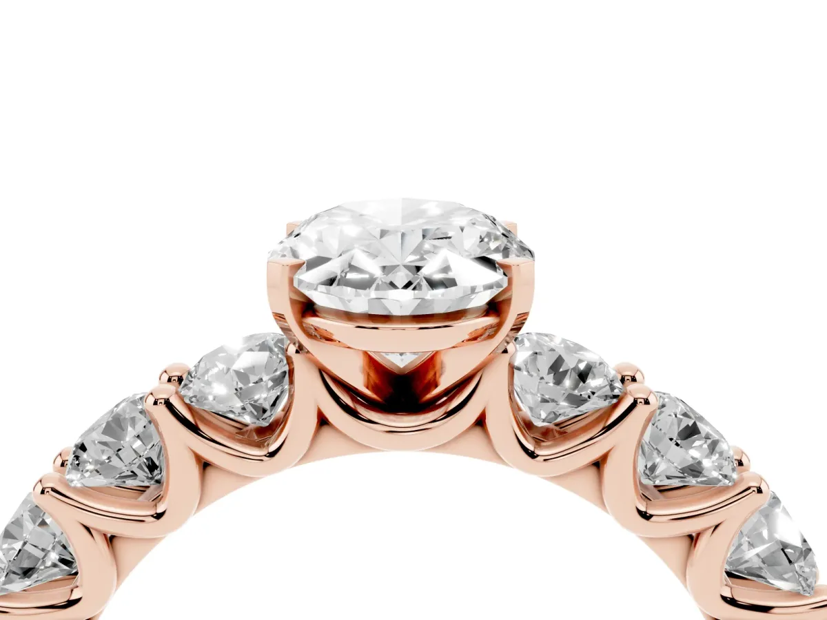 Oval Cut Diamond Prong Setting with Side Stones on a Pave Band Rose gold