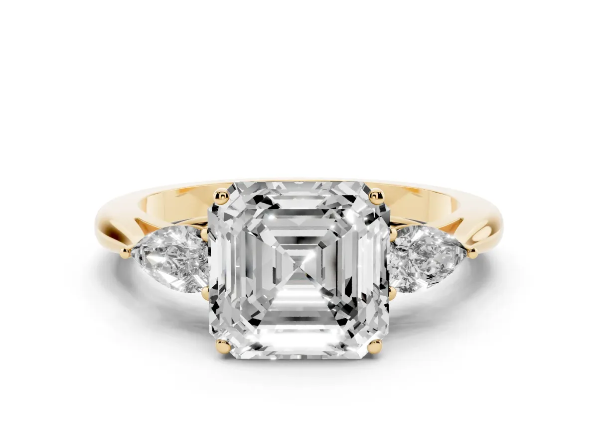 Three-Stone Asscher Cut Diamond Ring with Pear Side Stones in Four-Prong Setting Yellow gold