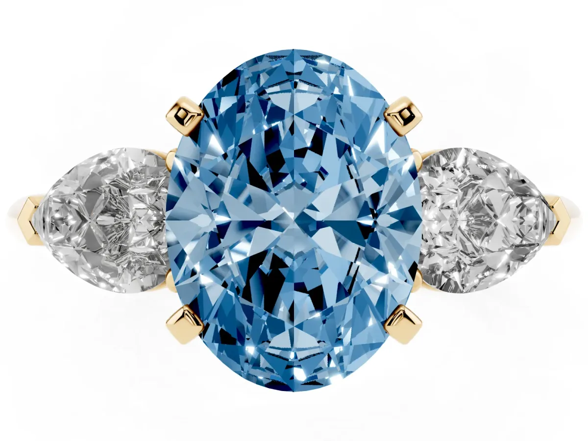 Fancy Blue Three-Stone Oval Cut Diamond Ring with Pear Side Stones and Four-Prong Setting Yellow gold