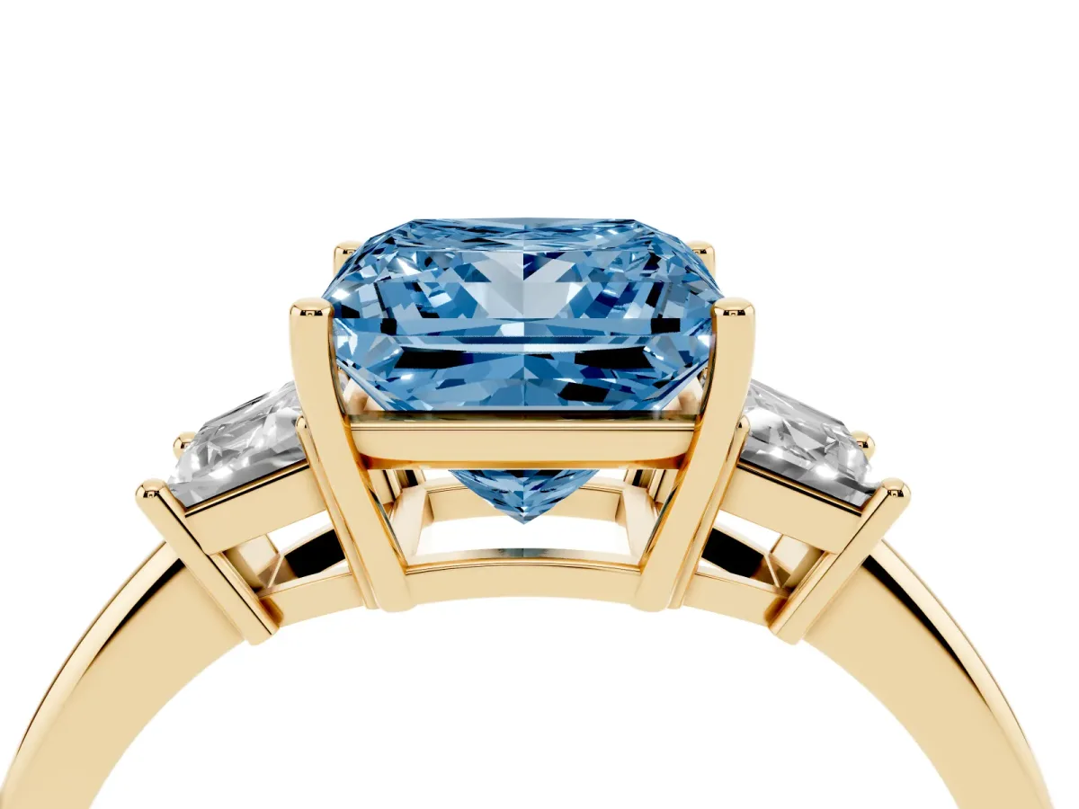 Fancy Blue Princess Cut Diamond Three-Stone Ring with Trapezoid Side Stones and Prong Setting Yellow gold