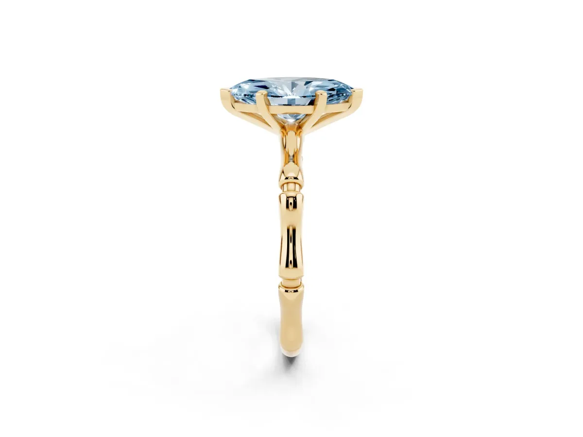 Fancy Blue Marquise Cut Solitaire Diamond Ring with Bamboo Band and Four-Prong Setting Yellow gold
