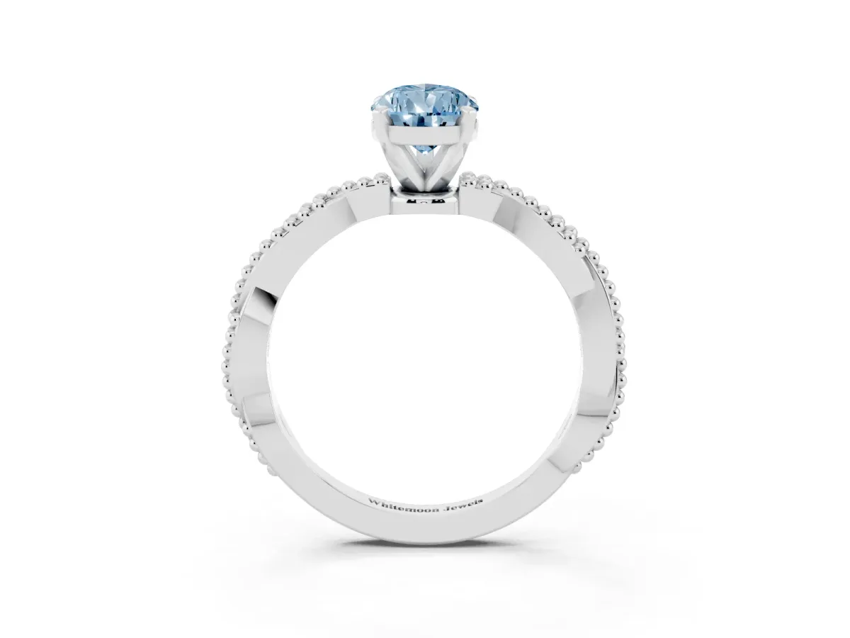 Fancy Blue Pear Cut Solitaire Twisted Band with Bead Prong Setting Platinum