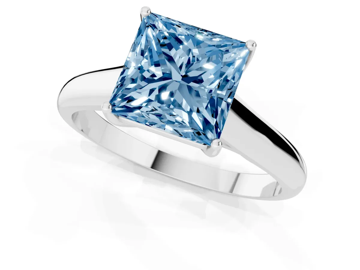 Fancy Blue Princess Cut Solitaire Engagement Ring with Tapered Band and Four-Prong Setting Silver