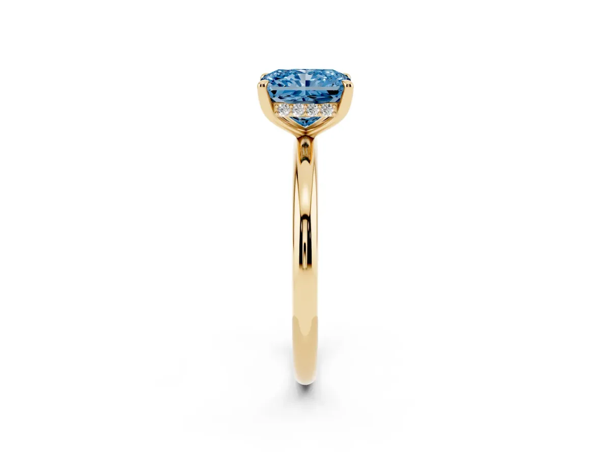Fancy Blue Radiant Cut Diamond Solitaire Ring with Thin Band and Four-Prong Setting Yellow gold