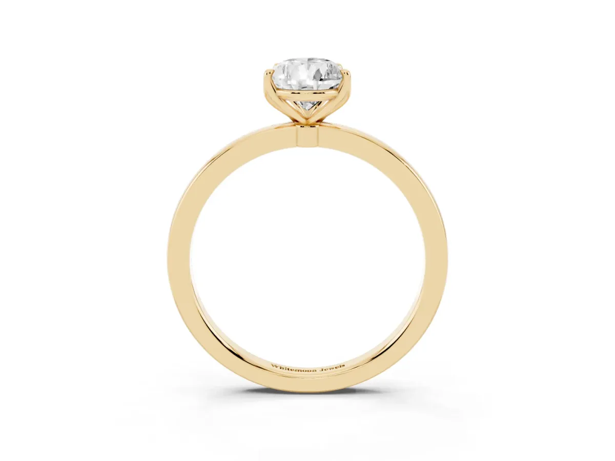 Pear Cut Diamond Solitaire Ring with Thin Band and Prong Setting Yellow gold