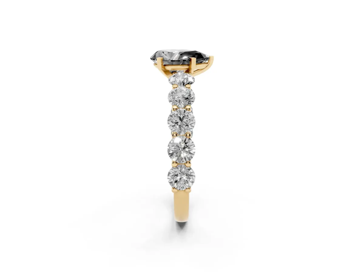 Fancy Black Pear Cut Diamond Prong Setting with Side Stones on a Pave Band Yellow gold