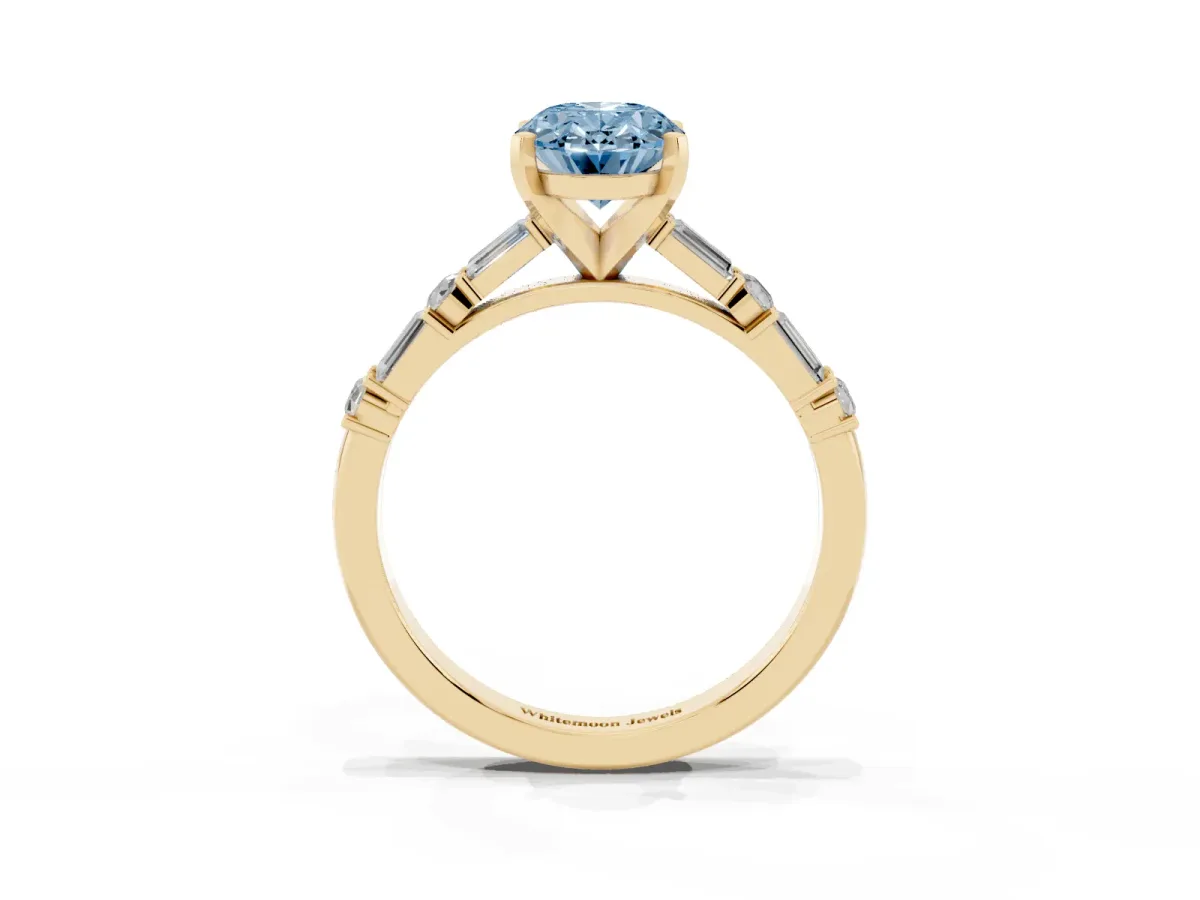 Fancy Blue Oval Cut Diamond Solitaire with Side Baguettes and Channel Set Band Yellow gold