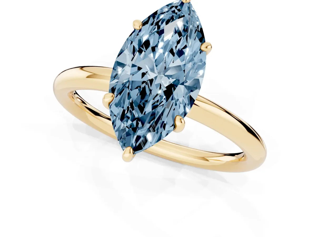 Fancy Blue Oval Cut Solitaire Diamond Ring with Four-Prong Setting on a Plain Band Yellow gold