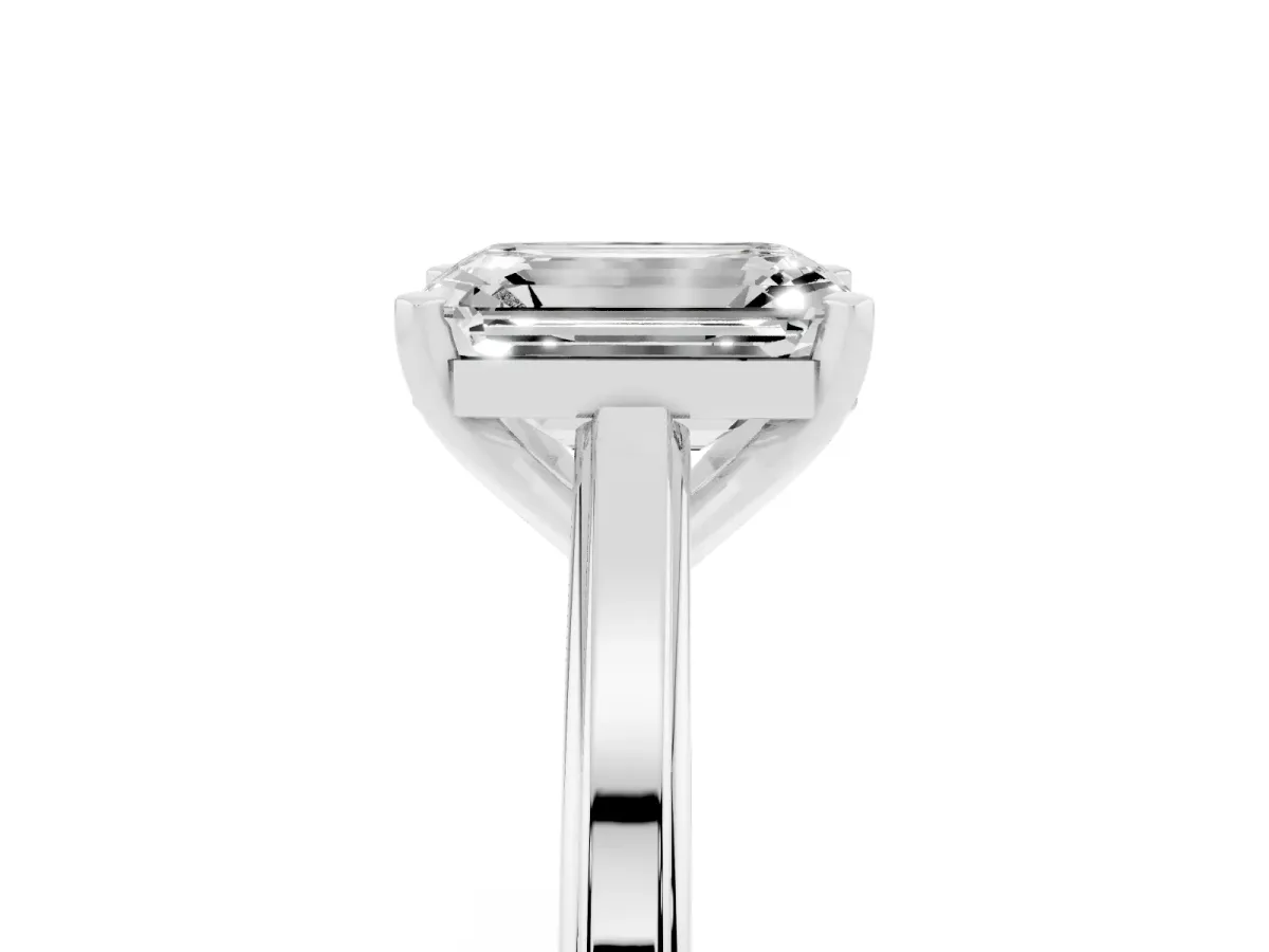 Emerald Cut Solitaire Diamond Ring with Four-Prong Setting and Classic Band Platinum