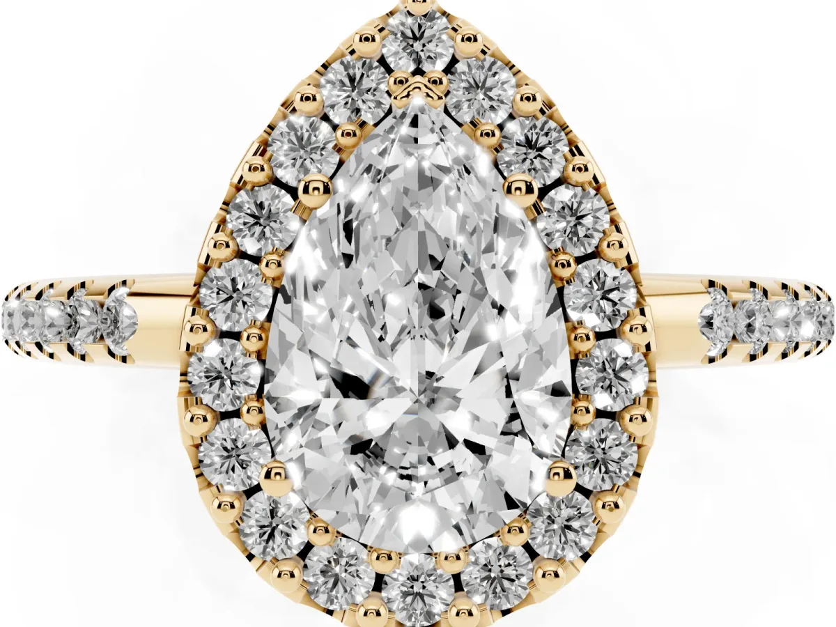 Pear Cut Diamond Pavé Halo Ring with Four-Prong Setting Yellow gold
