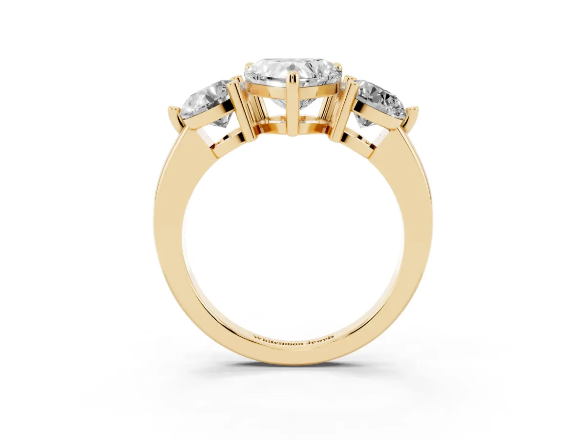 Three-Stone Heart Cut Brilliant Cut Solitaire Ring with Prong Setting on a Classic Band Yellow gold
