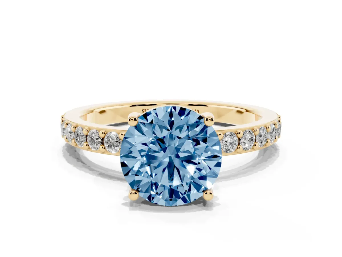 Fancy Blue Round Cut Cut Diamond Solitaire with Pave Band and Four-Prong Setting Yellow gold