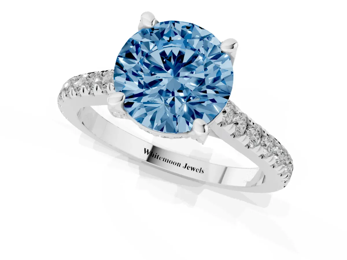 Fancy Blue Round Cut Brilliant Diamond Solitaire with Pavé Band and Four-Prong Setting Platinum