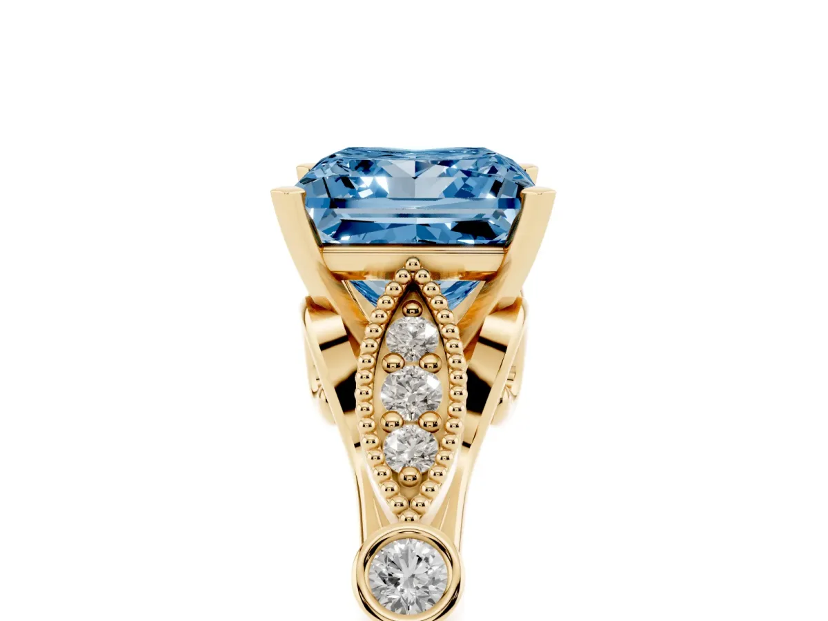 Fancy Blue Princess Cut Cut Diamond with Milgrain Marquise and Bezel Accents on a Solitaire Band with Prong Setting Yellow gold