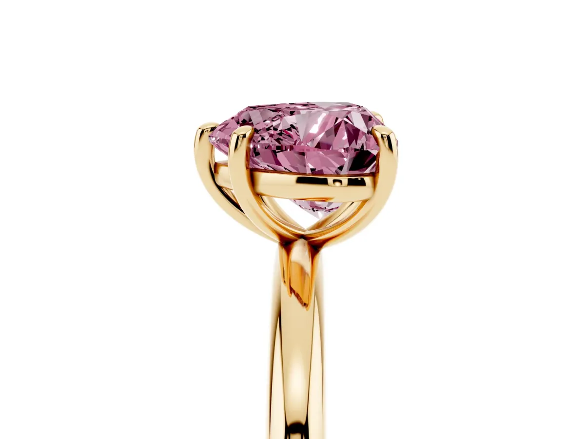 Fancy Pink Heart Cut Solitaire Diamond Ring with Four-Prong Setting on a Plain Band Yellow gold