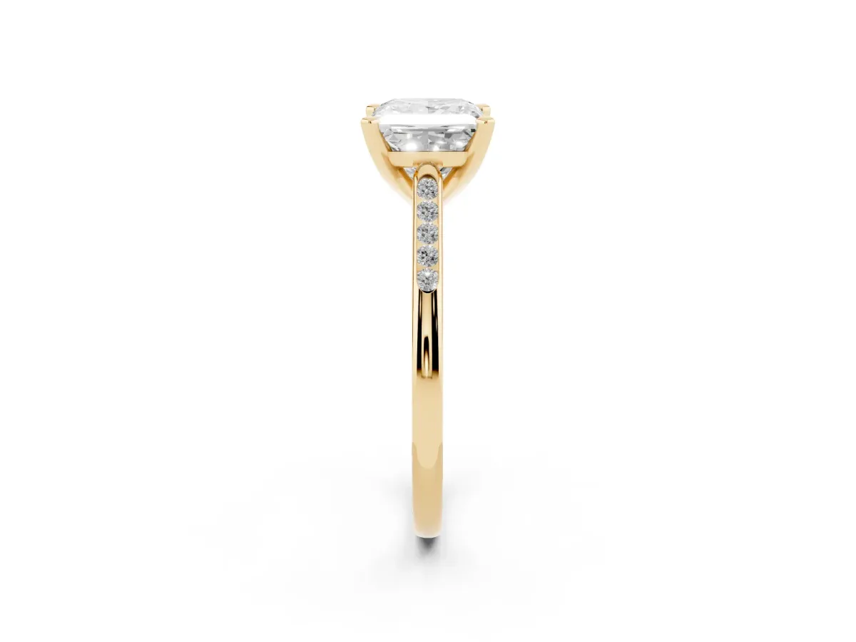 Princess Cut Diamond Solitaire Ring with Channel Set Round Band and Prong Setting Yellow gold