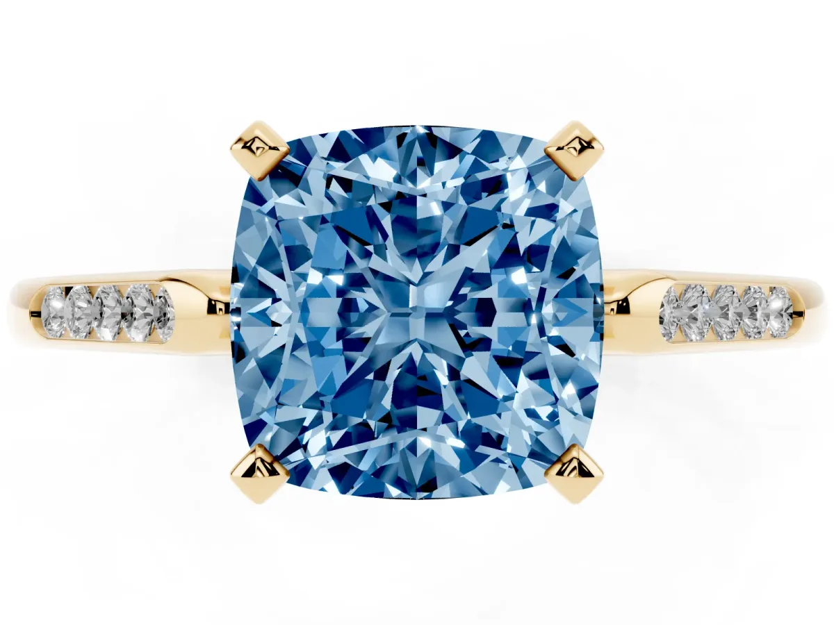 Fancy Blue Cushion Cut Diamond Solitaire Ring with Channel Set Round Band and Prong Setting Yellow gold
