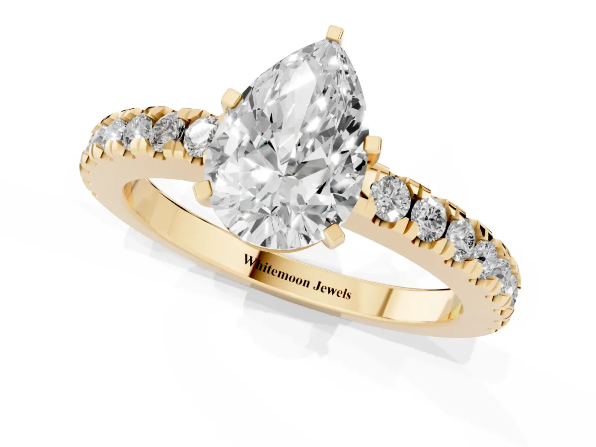 Pear Cut Solitaire Diamond with Pavé Band and Four-Prong Setting Yellow gold