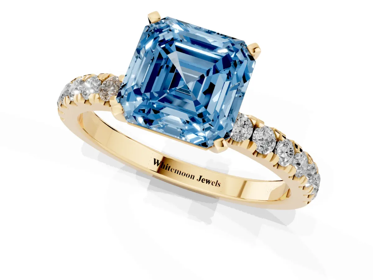 Fancy Blue Asscher Cut Diamond Solitaire Ring with Pavé Accents and Four-Prong Setting Yellow gold