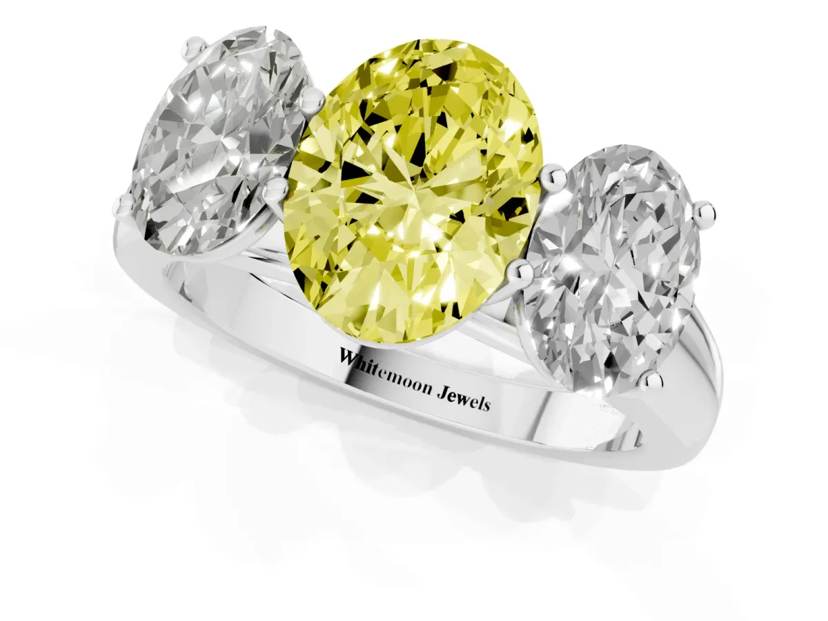 Fancy Yellow Oval Cut Three-Stone Diamond Ring with Prong Setting on a Classic Band Platinum