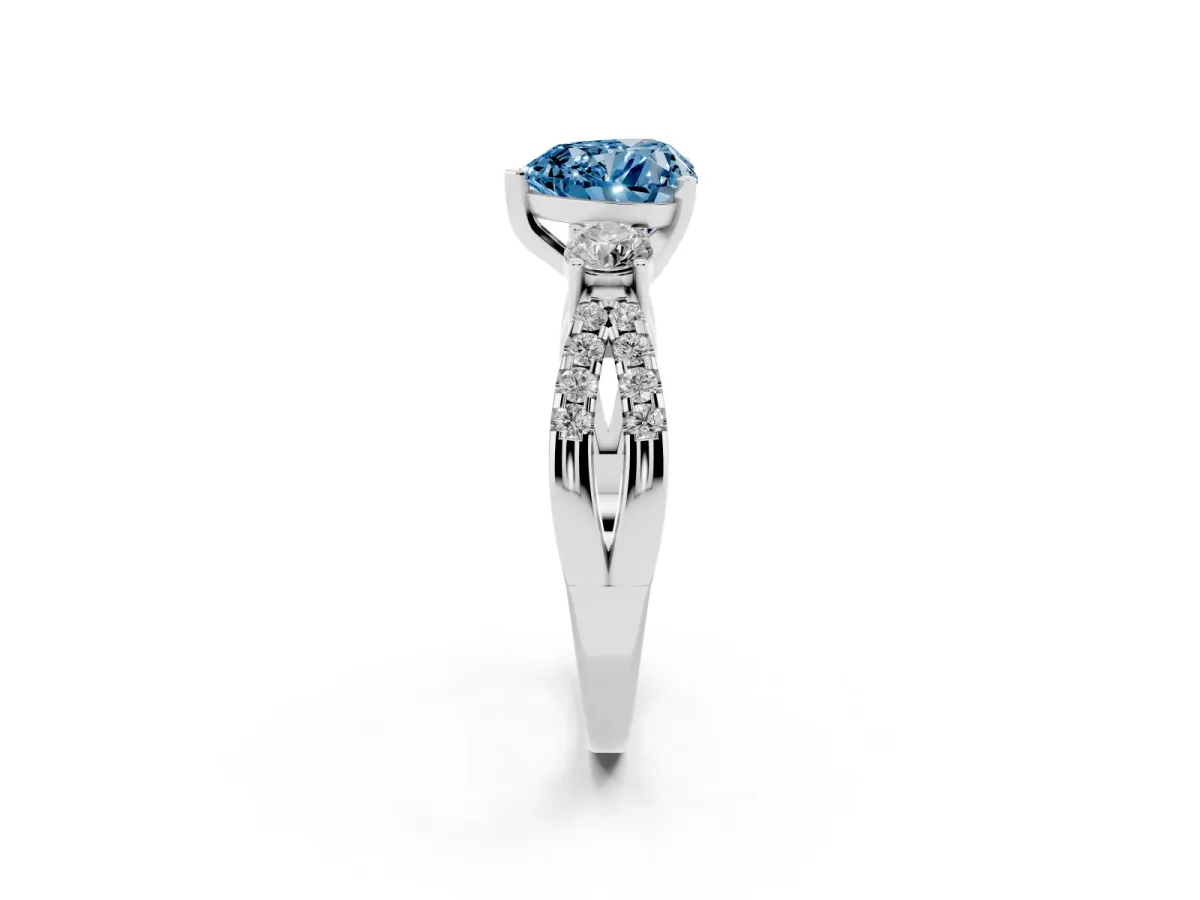 Fancy Blue Heart Cut Diamond Three-Stone Ring with Pavé Split Shank and Four-Prong Setting Silver