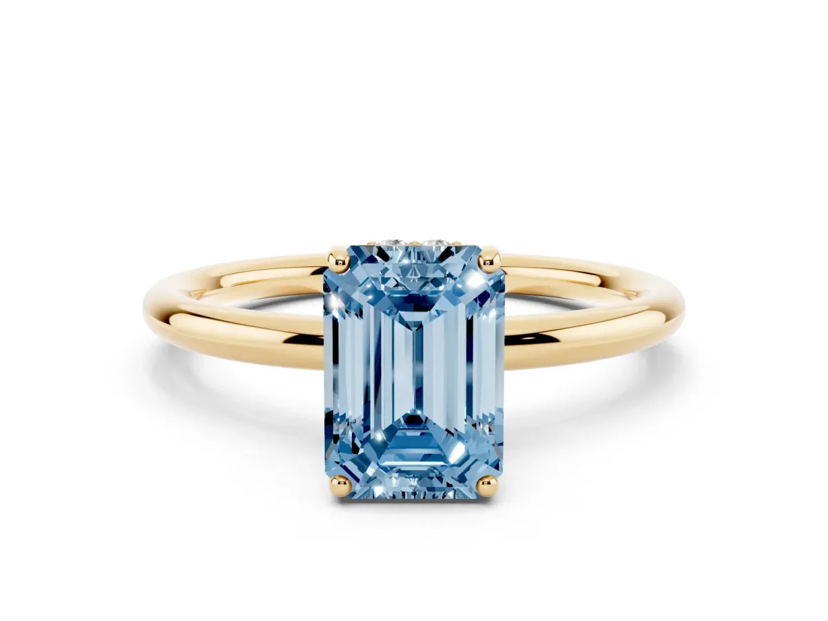 Fancy Blue Emerald Cut Solitaire Diamond Ring with a Classic Band and Four-Prong Setting Yellow gold