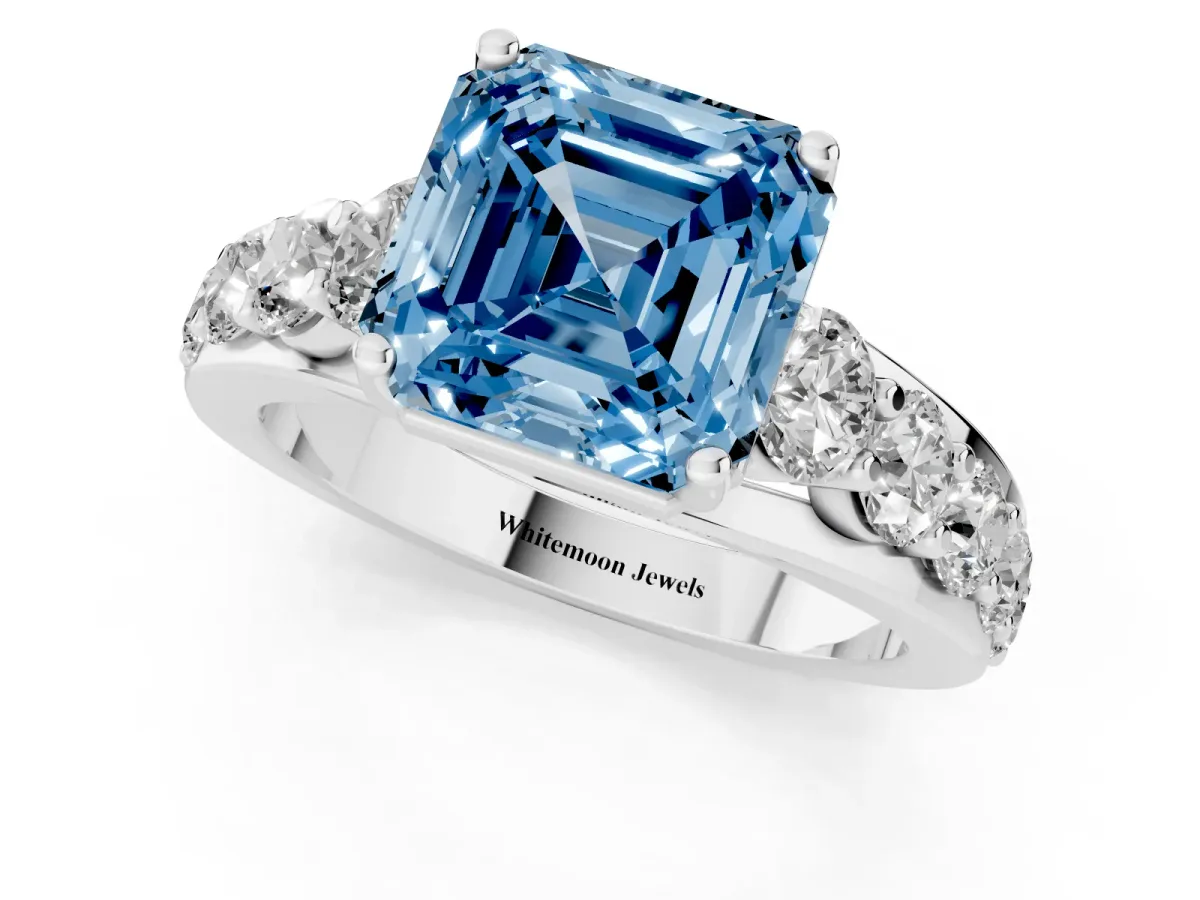 Fancy Blue Asscher Cut Diamond Engagement Ring with Pavé Band and Four-Prong Setting Silver