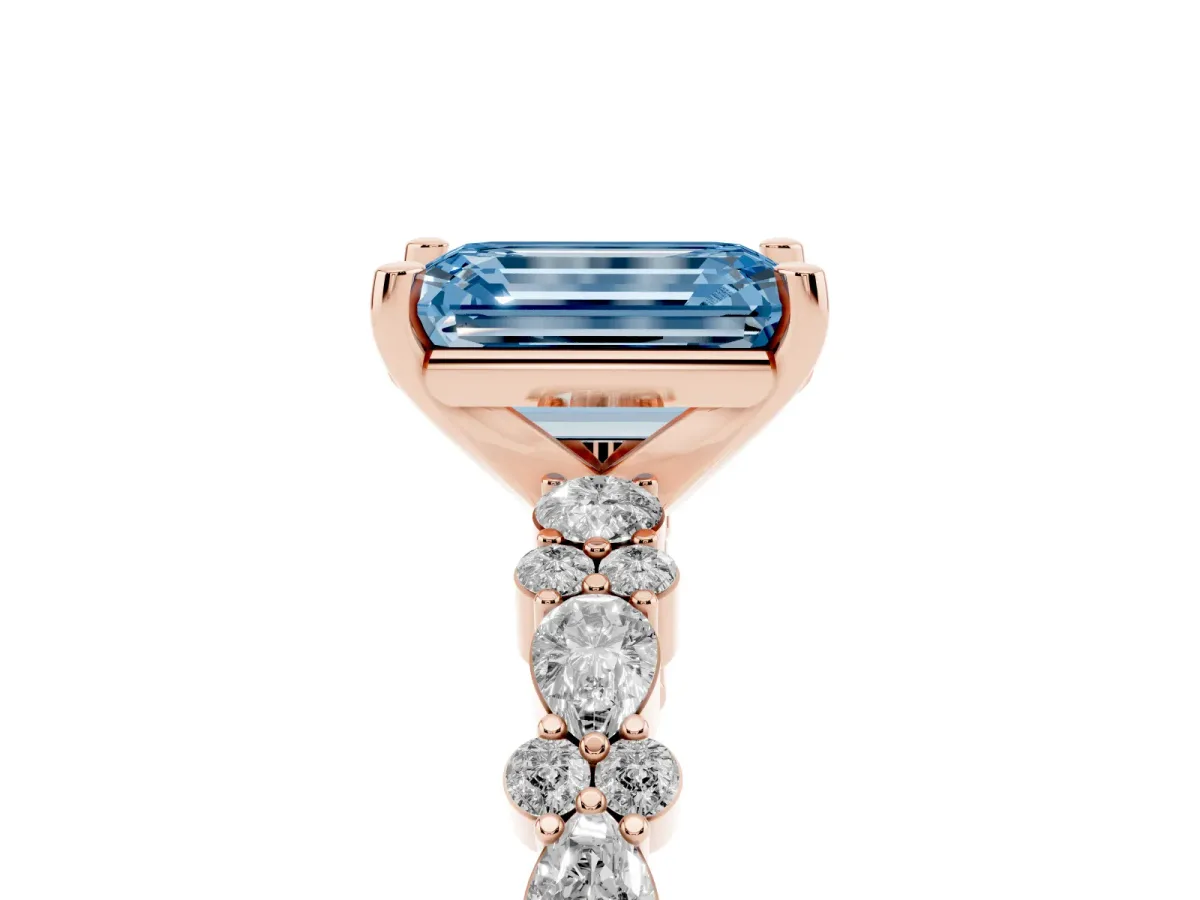 Fancy Blue Emerald Cut Diamond Side Stone Solitaire Ring with Round and Four-Prong Setting Rose gold