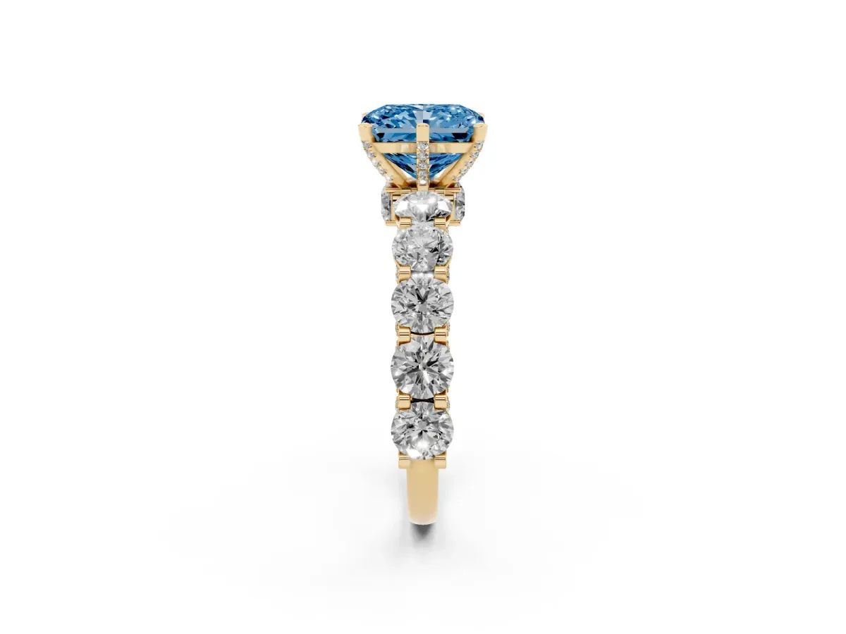 Fancy Blue Radiant Cut Diamond Side Stone Engagement Ring with Four-Prong Setting Yellow gold