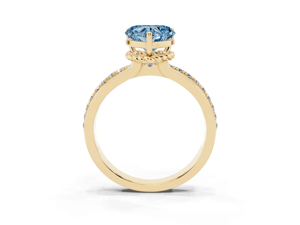 Fancy Blue Heart Cut Solitaire Diamond Ring with Channel Set Band and Six-Prong Setting Yellow gold