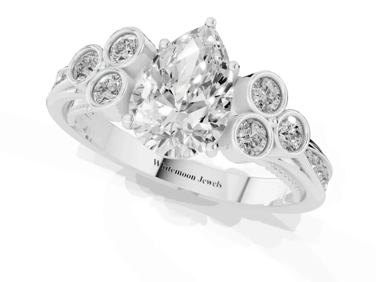 Pear Cut Cut Diamond Engagement Ring with Bezel Set Round Side Stones and Prong Setting Silver