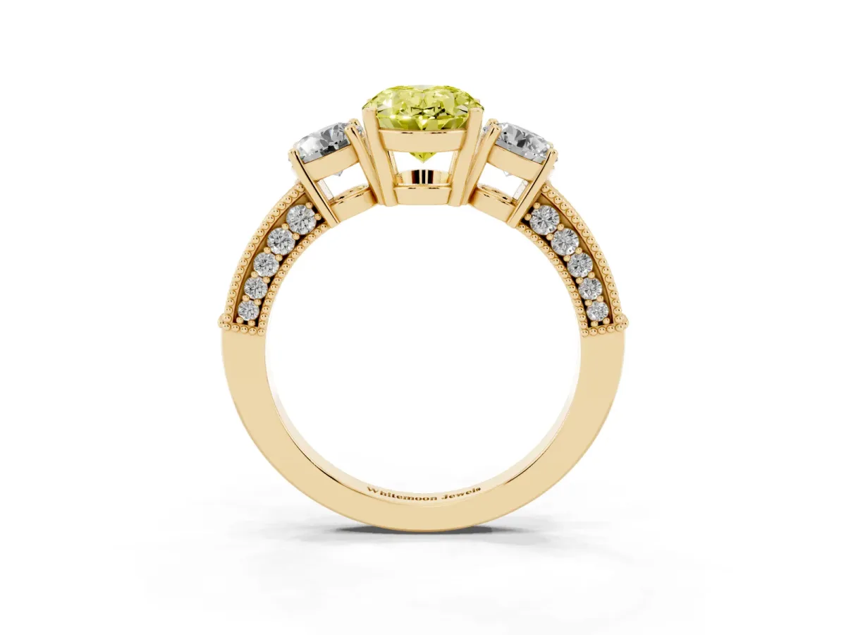 Fancy Yellow Oval Cut Three-Stone Diamond Ring with Pavé Band and Four-Prong Setting Yellow gold