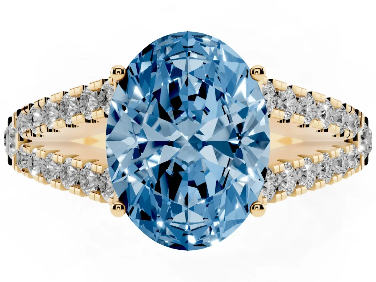 Fancy Blue Oval Cut Diamond Split Shank Pavé Engagement Ring with Four-Prong Setting Yellow gold
