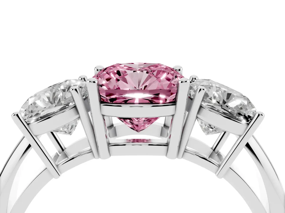Fancy Pink Three-Stone Cushion Cut Cut Diamond Engagement Ring with Prong Setting on a White Gold Band Platinum