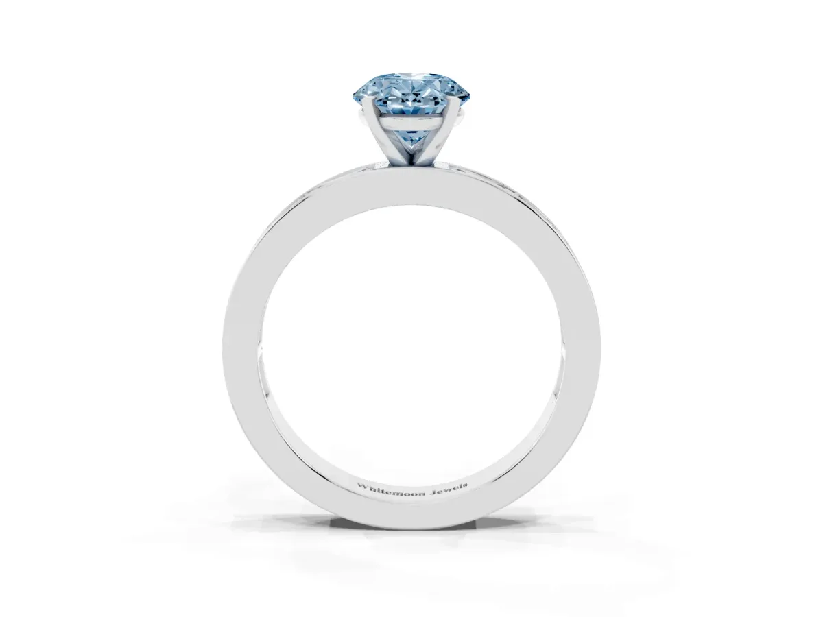 Fancy Blue Oval Cut Solitaire Diamond Ring with Channel-Set Baguette Band and Four-Prong Setting White gold