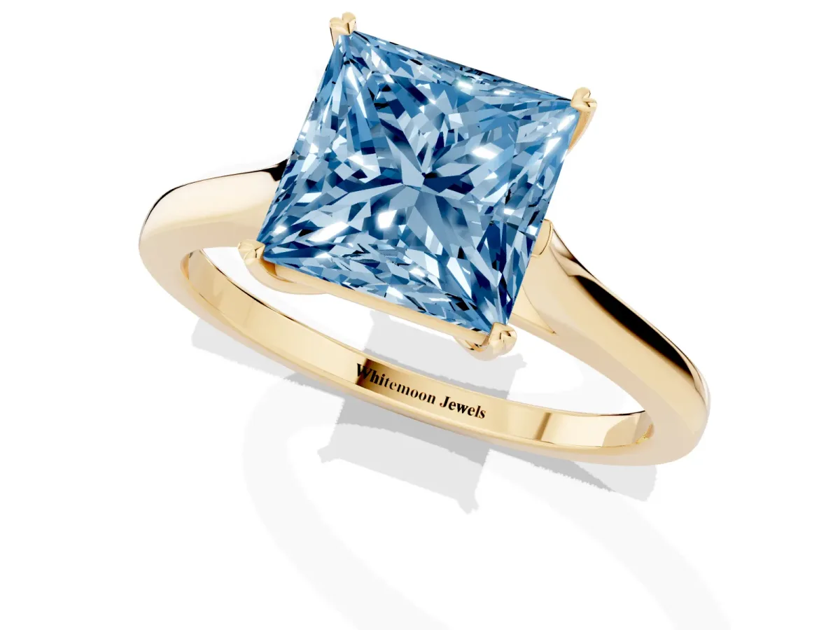Fancy Blue Princess Cut Solitaire Heart Prong Engagement Ring with Tapered Band Yellow gold