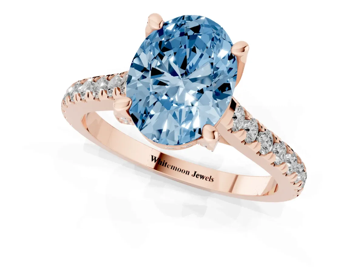 Fancy Blue Oval Cut Brilliant Diamond Solitaire with Pavé Band and Four-Prong Setting Rose gold