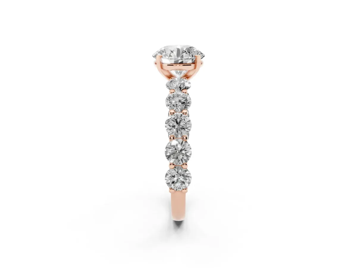 Round Cut Diamond Prong Setting with Side Stones on a Pave Band Rose gold