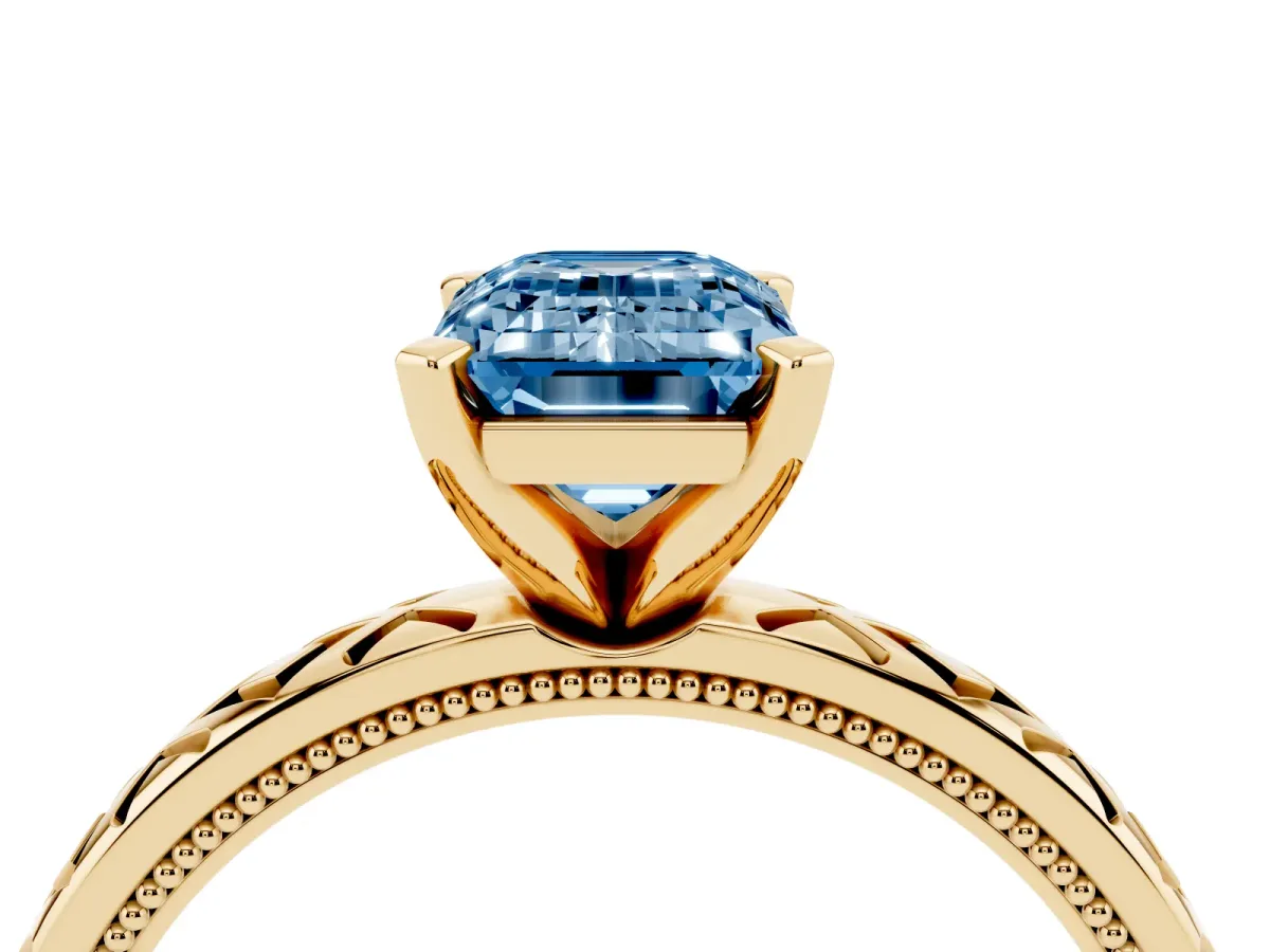 Fancy Blue Emerald Cut Solitaire Diamond Ring with Milgrain and Black Enamel X Pattern Band Yellow gold